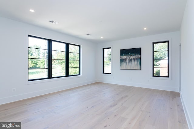 spare room with light wood-type flooring