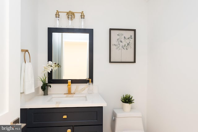 bathroom featuring vanity and toilet