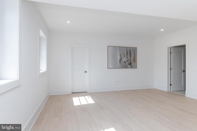 spare room with light hardwood / wood-style flooring