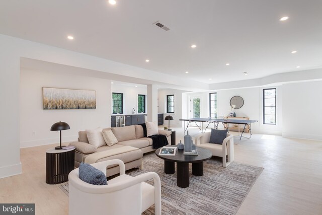 living room with light hardwood / wood-style flooring