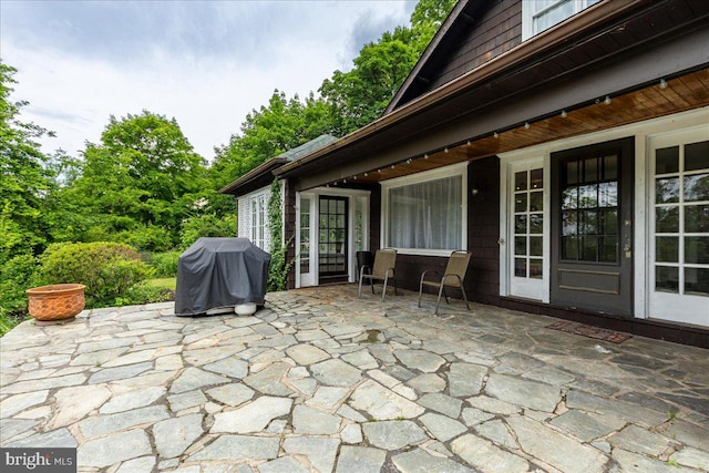 view of patio featuring a grill