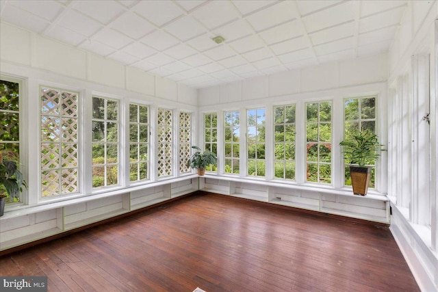 unfurnished sunroom with a drop ceiling