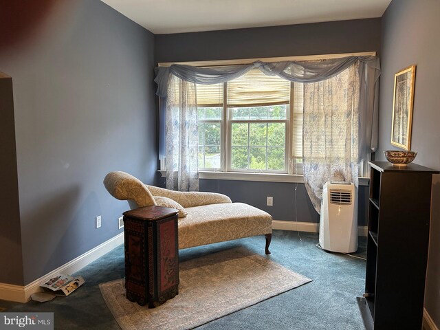 bedroom with carpet floors and baseboards