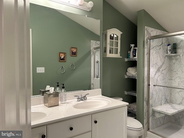 bathroom with walk in shower, vaulted ceiling, vanity, and toilet