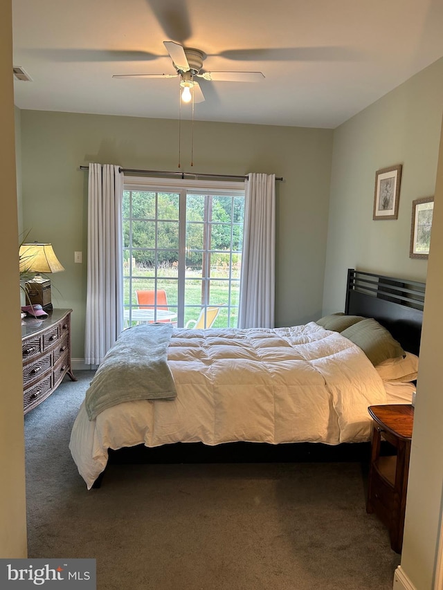 bedroom with dark carpet, access to outside, and ceiling fan