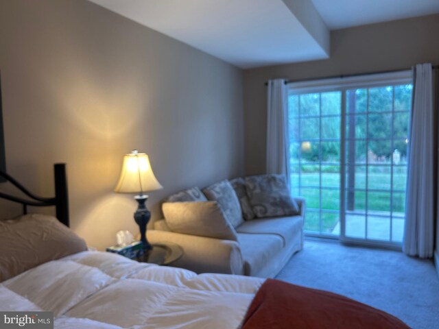 carpeted bedroom featuring access to outside