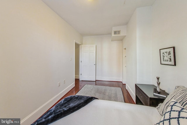 bedroom featuring dark wood-type flooring