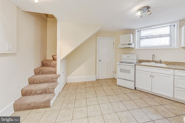 kitchen featuring premium range hood, sink, white electric range oven, white cabinetry, and light tile patterned flooring