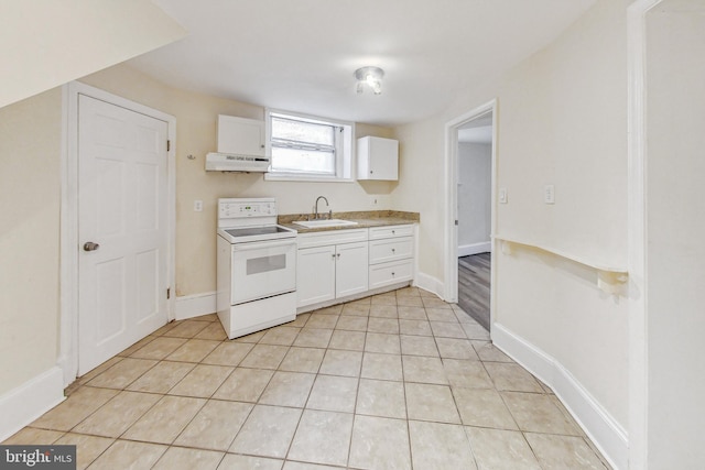 kitchen with white cabinetry, sink, light tile patterned floors, and white electric range