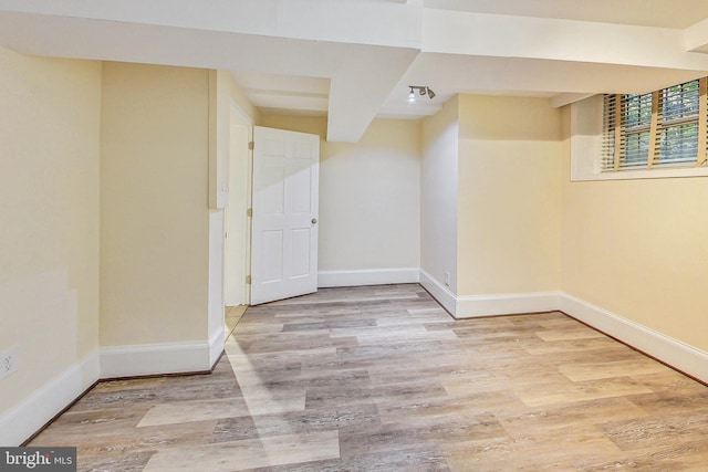 spare room with light hardwood / wood-style flooring