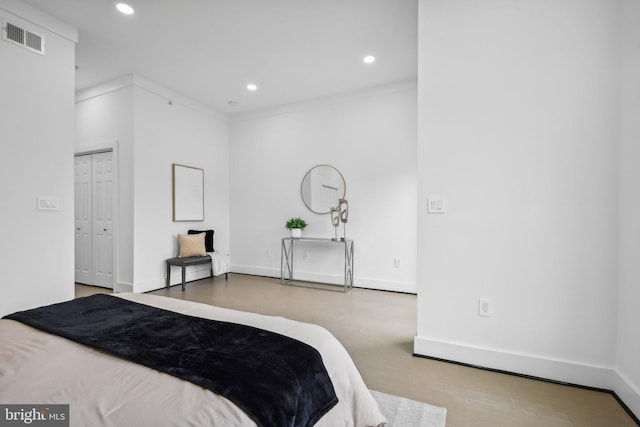 bedroom with a closet and light hardwood / wood-style flooring