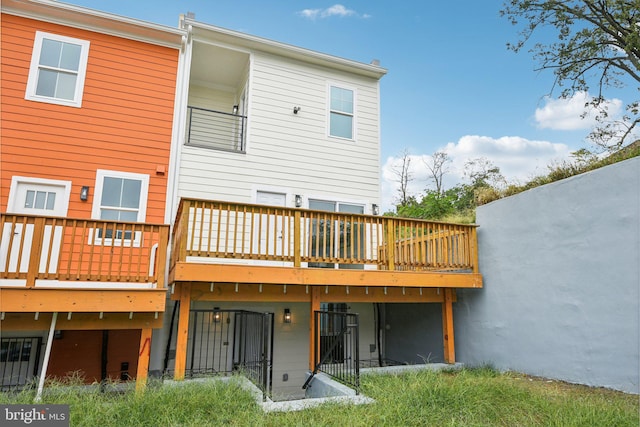 rear view of house featuring a deck