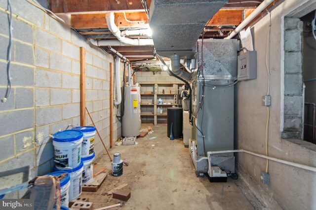 basement featuring gas water heater and heating unit