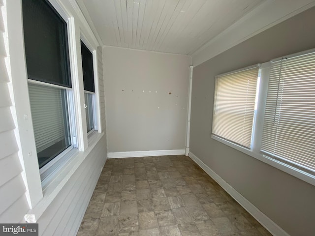 spare room with wood ceiling