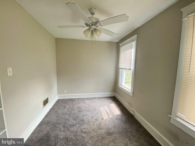 spare room featuring carpet flooring and ceiling fan