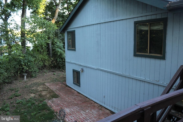 view of side of home featuring a patio area