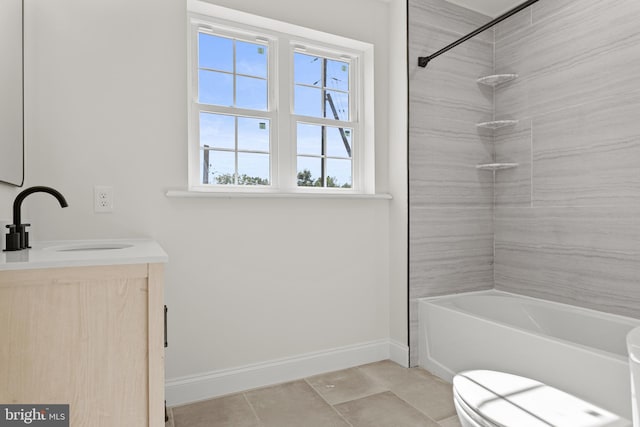 full bathroom featuring vanity, toilet, tiled shower / bath combo, and tile patterned flooring