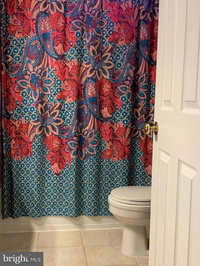 bathroom featuring tile patterned floors and toilet