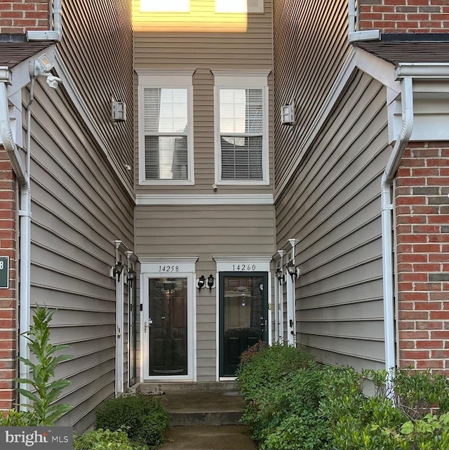 entrance to property with brick siding