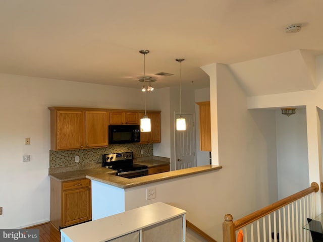 kitchen featuring pendant lighting, stainless steel electric range, backsplash, light hardwood / wood-style floors, and kitchen peninsula