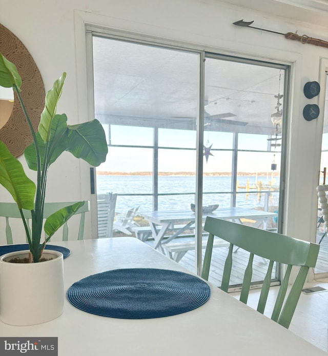 dining room featuring a water view