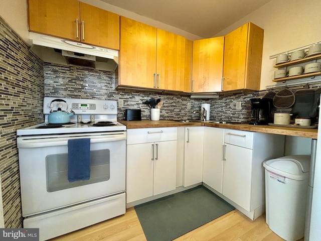 kitchen featuring decorative backsplash, white cabinetry, white electric range oven, and light hardwood / wood-style floors