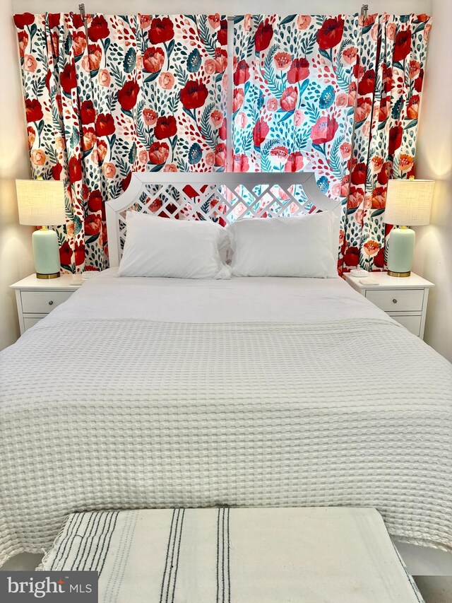 bedroom with wooden walls