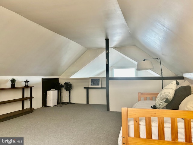 carpeted bedroom featuring lofted ceiling