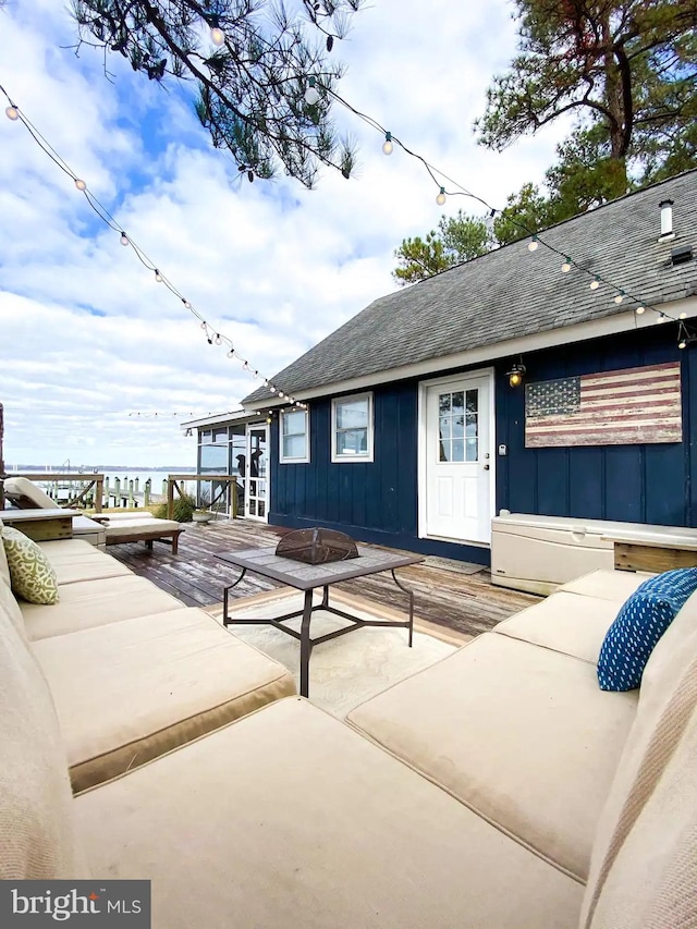 deck with a patio and a fire pit