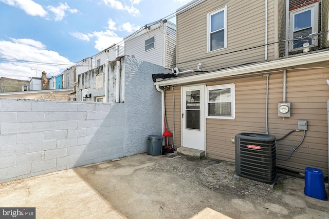 back of house with cooling unit