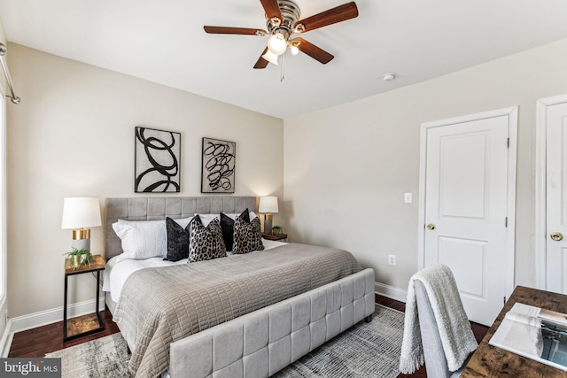 bedroom with ceiling fan and wood-type flooring