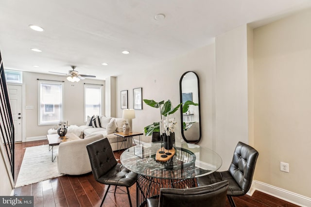 dining area featuring ceiling fan and dark hardwood / wood-style floors