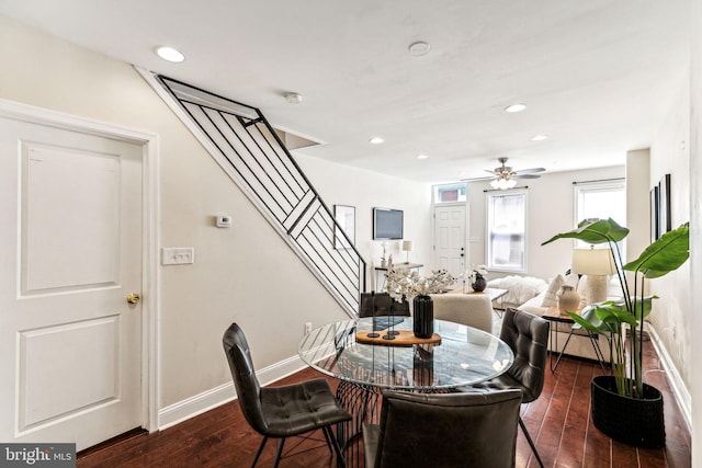 dining space featuring ceiling fan and dark hardwood / wood-style flooring