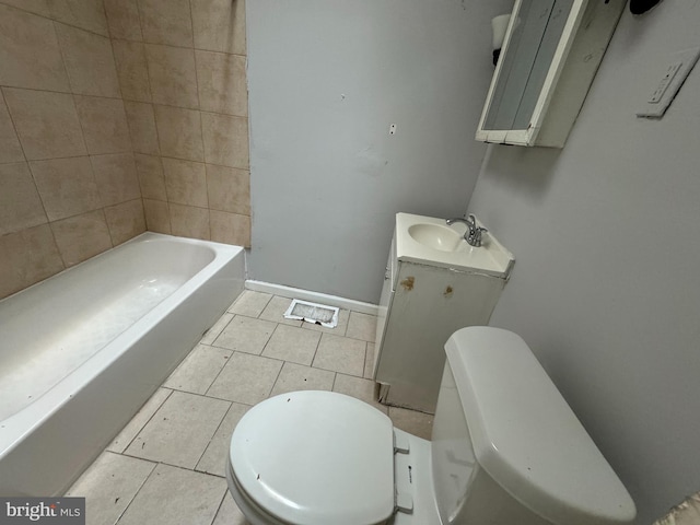 bathroom featuring tile patterned floors, toilet, and vanity