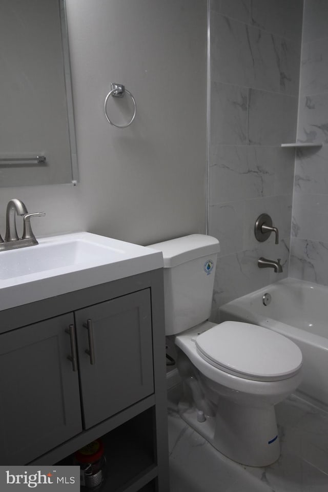 full bath with marble finish floor, vanity, shower / bath combination, and toilet