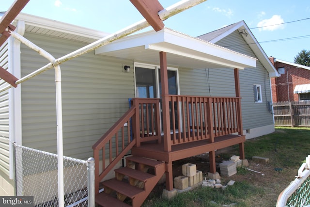 exterior space with fence and crawl space