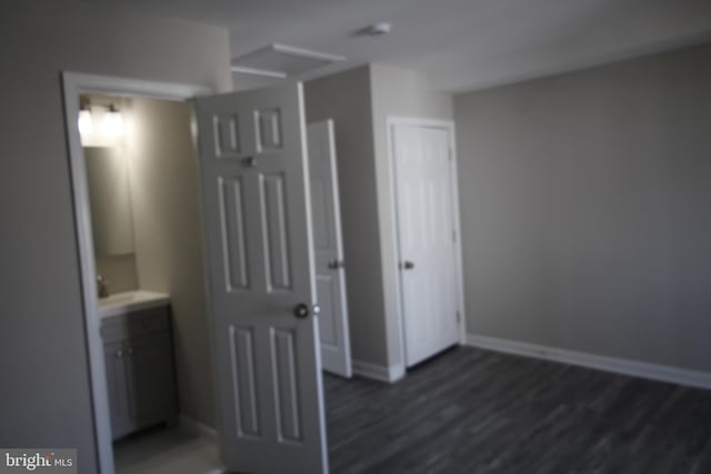 interior space with dark wood-style floors and baseboards