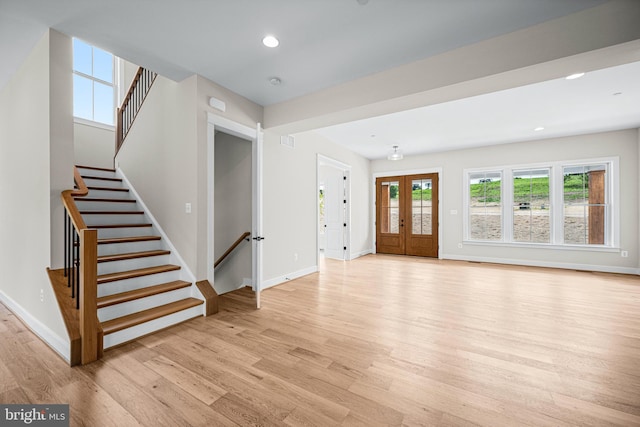 unfurnished living room featuring light wood-type flooring