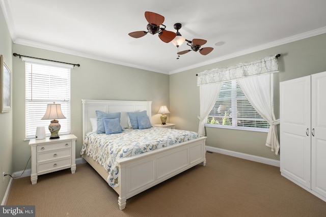 carpeted bedroom featuring ornamental molding and ceiling fan