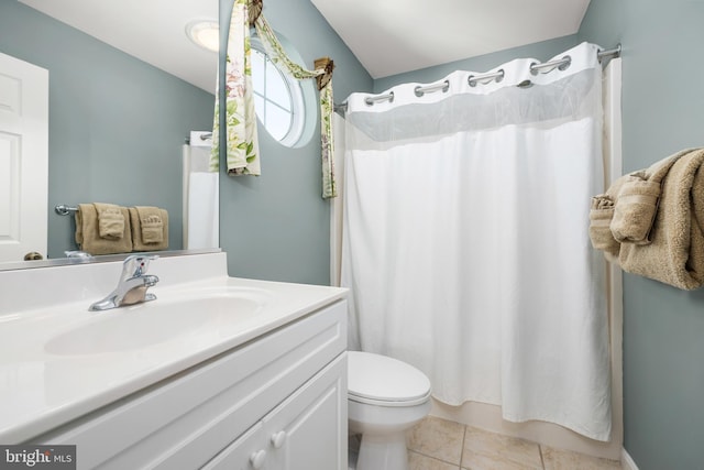 bathroom featuring tile patterned flooring, vanity, a shower with shower curtain, and toilet