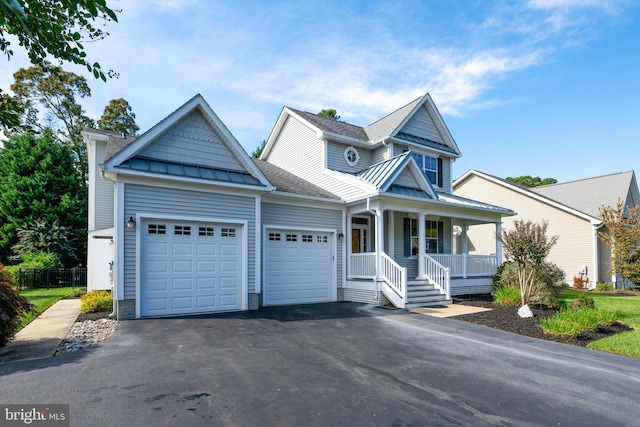 view of front facade with a garage and covered porch