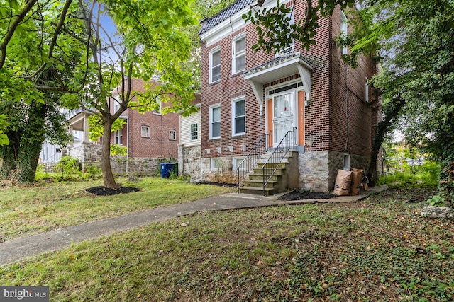 view of property with a front lawn