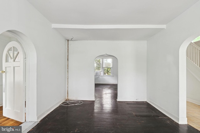 unfurnished room with hardwood / wood-style floors