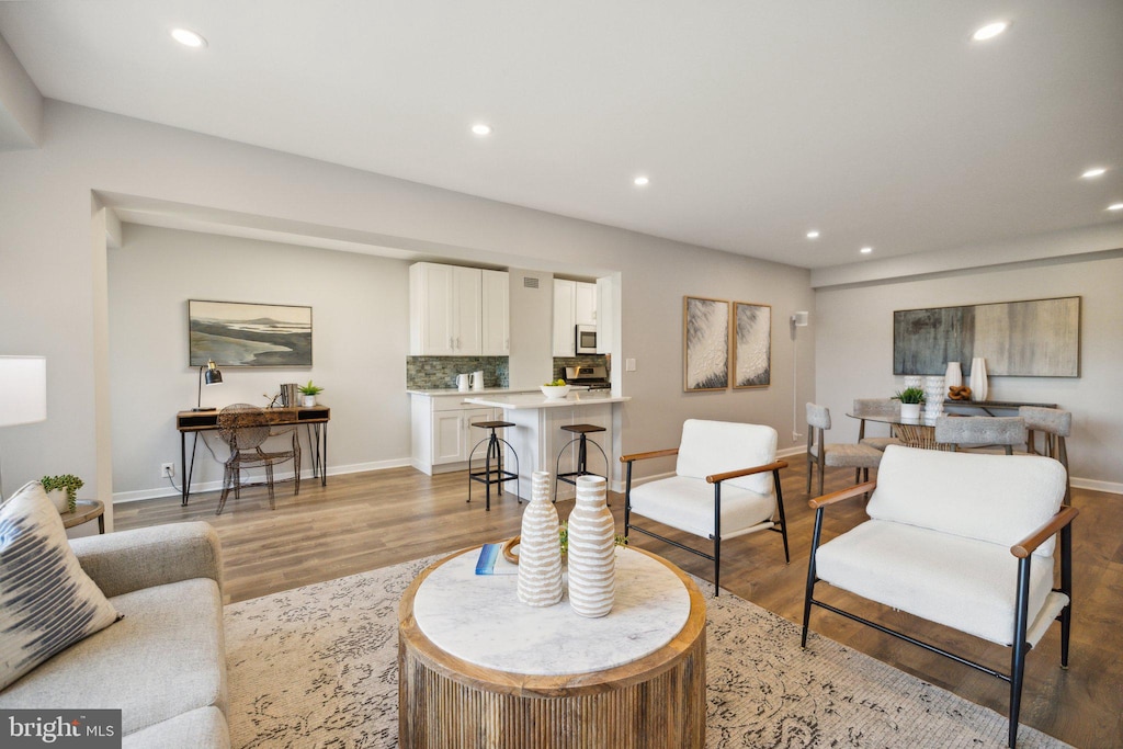 living room with light hardwood / wood-style floors