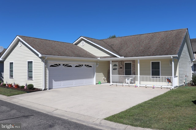 single story home with a porch, a garage, and a front lawn