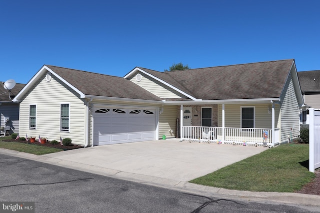 ranch-style home with a porch and a garage