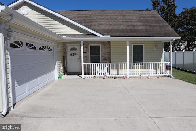 view of front facade with a garage and covered porch