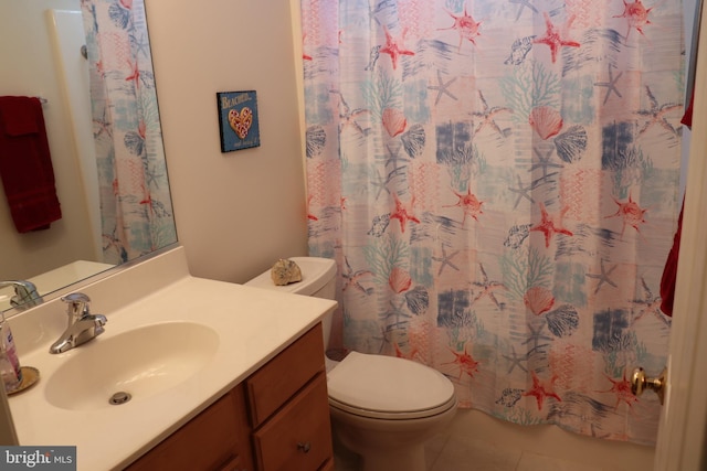 full bath with tile patterned flooring, curtained shower, toilet, and vanity