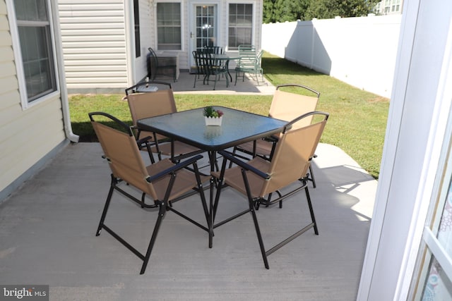 view of patio / terrace featuring outdoor dining area and fence