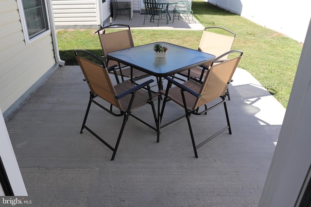 view of patio / terrace with a deck and outdoor dining area